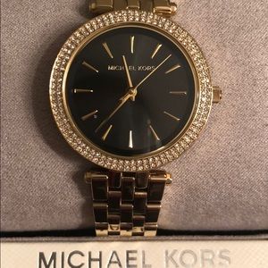 Michael Kors gold watch/black display. Like new